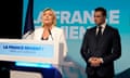 The French far-right leader Marine Le Pen speaking yesterday as Jordan Bardella, the president of her party, National Rally, listens at the election night HQ.