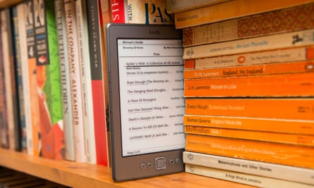 An Amazon kindle on a bookshelf
