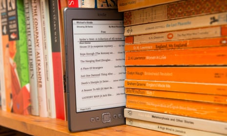 An Amazon Kindle on a bookshelf