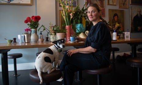Joanna Wilson owner of John Gorilla cafe in West Brunswick, with her dog Dizzy, talking about the price hike of raw ingredients for one of her customer favourites, the Avocado Piquillo with a side of bacon and a coffee. Australia.