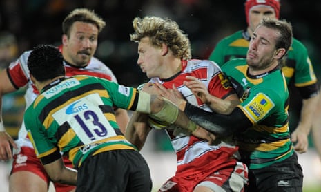 Billy Twelvetrees of Gloucester is tackled by JJ Hanrahan of Northampton during the Premiership match