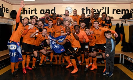 Wolves players celebrate promotion after beating Birmingham City at Molineux.