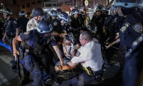 A protester is arrested on Fifth Avenue by NYPD officers during a march, Thursday, June 4, 2020, in the Manhattan borough of New York. Protests continued following the death of George Floyd, who died after being restrained by Minneapolis police officers on May 25. (AP Photo/John Minchillo)