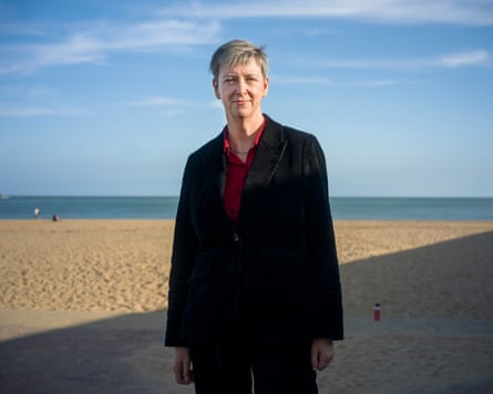Polly Billington standing by the beach in Ramsgate on a sunny day