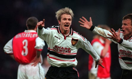 Manchester United’s David Beckham celebrates scoring the first goal.