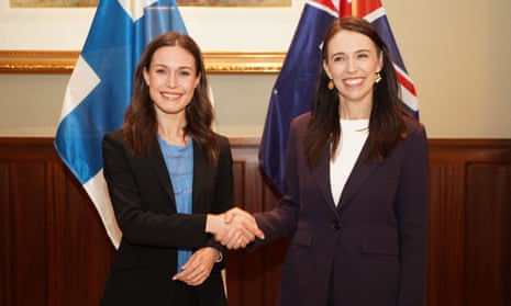 Finland Prime Minister Sanna Marin shakes hands with New Zealand Prime Minister Jacinda Ardern.