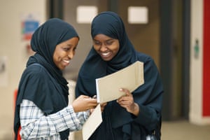Yasmin Adan (left) and Asmaa Ali receive their A-level results at Oasis Academy Hadley in Enfield, London