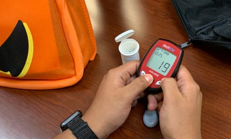 A person learns how to use a glucometer at Childrens National Hospital in Washington, DC