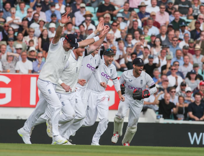 England wicketkeeper Ben Foakes (right) and his teammates celebrate as he catches Kyle Verreynne of South Africa off the bowling of Ollie Robinson.