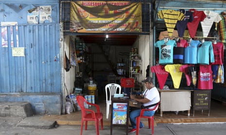 Luis Olarte, a shopkeeper in the Colombian town of Puerto Santander, outside a store filled with subsidised goods smuggled over the border from Venezuela