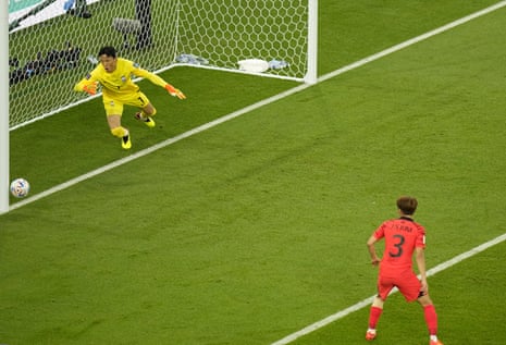 Kim Seung-gyu watches as Godin’s header hits the post.