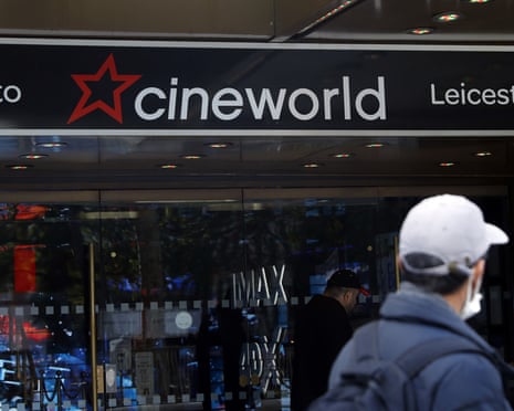 Man walks past Cineworld theatre in Leicester Square, London.