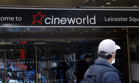 Man walks past Cineworld theatre in Leicester Square, London.
