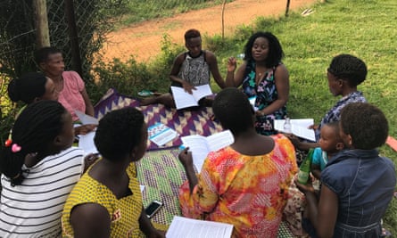 Diana Namumbejja Abwoye with a women’s group in Uganda, discussing Our Bodies, Ourselves