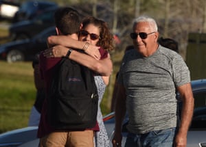 Students are reunited with their parents outside Marjory Stoneman Douglas high school.