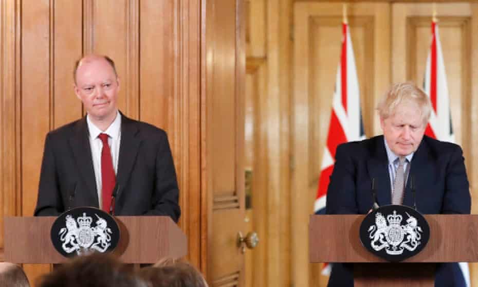 Chris Whitty, left, stands beside Boris Johnson as the prime minister outlines the UK’s strategy for dealing with the coronavirus outbreak on Tuesday.