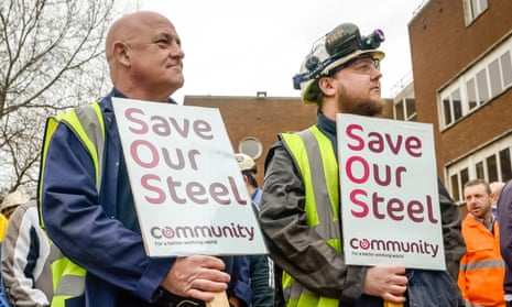 Workers wait to confront the business secretary, Sajid Javid, as he leaves Tata Steel in Port Talbot.