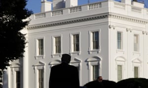 Donald Trump in silhouette against the White House