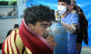 A man receives treatment at the Sarmin field hospital