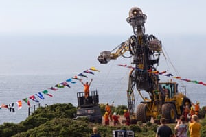 Giant metal man sculpture in a field near the coast. The Man Engine Resurrection Tour.