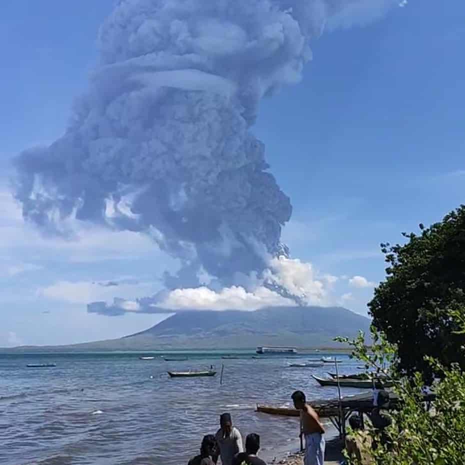 Residents of Lembata, East Nusa Tenggara, watch the eruption of Mount Ili Lewotolok on Sunday.