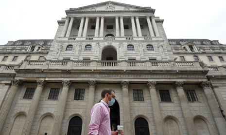 Masked worker passes Bank of England