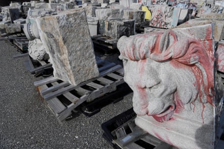 lion’s head with red spray paint on it