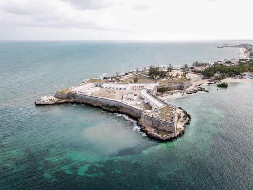 aerial shot of an old fortress on a peninsula