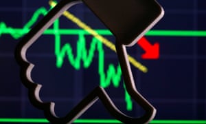 A thumb down symbol in front of a stock graph