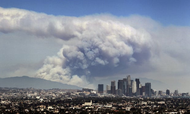 Smoke from burning wildfires fills the sky behind Los Angeles in 2016