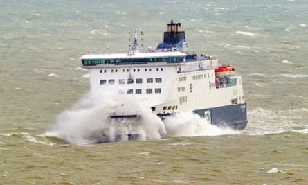 The ferry Cote Des Flandres ploughs through stormy seas into Dover harbour on its from Calais