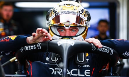 Max Verstappen prepares for a practice run in a gold helmet after successfully defending his world title.