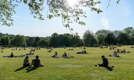 People maintaining physical distance in Hilly Fields park, London. 