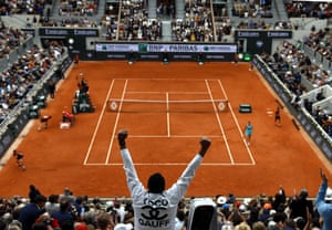 A supporter of Coco Gauff cheers her on