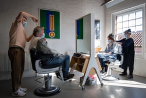 Two people having haircuts