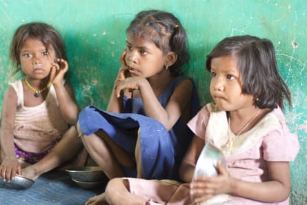 Children wait for food at a care centre in Khoch, in the west Indian state of Maharashtra