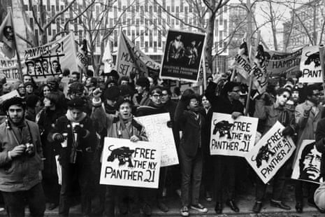 Demonstrators with raised fists and placards at a protest, near a federal courthouse, to free the Panther 21.