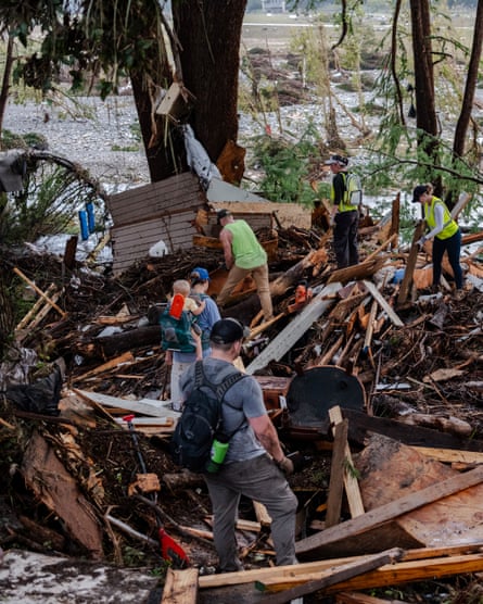 Search and rescue workers dig through debris