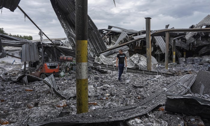 Local resident Olexander inspects his beverages plant that was destroyed by a Russian missile on Monday night in the Kharkiv region of Ukraine.