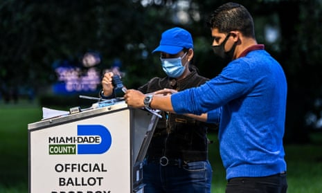 People at a ballot drop box in Miami-Dade county, florida