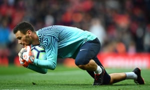 Hugo Lloris warms up at Old Trafford.