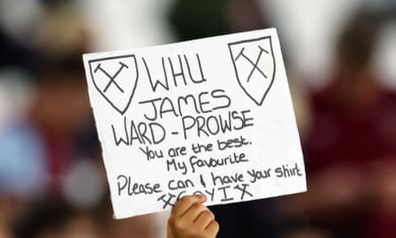 A West Ham fan holds up a sign asking for James Ward-Prowse’s shirt
