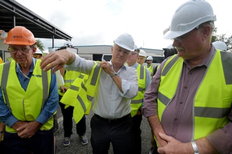 Malcolm Turnbull puts on a high vis vest as he takes a tour of the Norship Marine shipyards in Cairns on Wednesday.