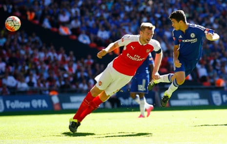 Per Mertesacker does just enough to put off Oscar’s header attempt.