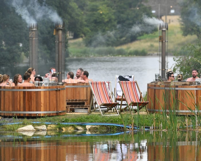Hot tubs and £80 rosé: how the mud-soaked British festival got a luxury makeover