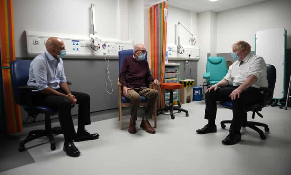 Boris Johnson, right, and Sajid Javid speak to a patient, Arthur McCune, at Leeds General Infirmary last week.