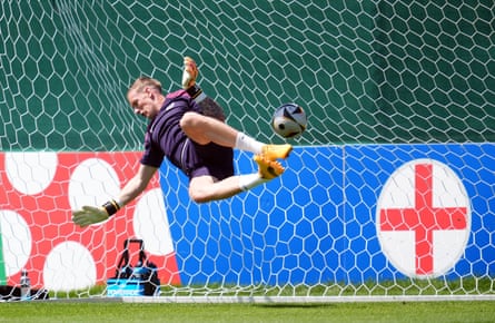 Jordan Pickford dives to make a save in training