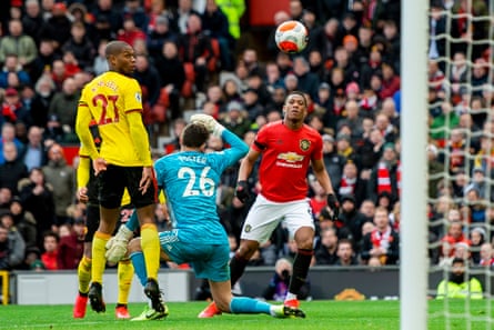 Anthony Martial chips home United’s second.