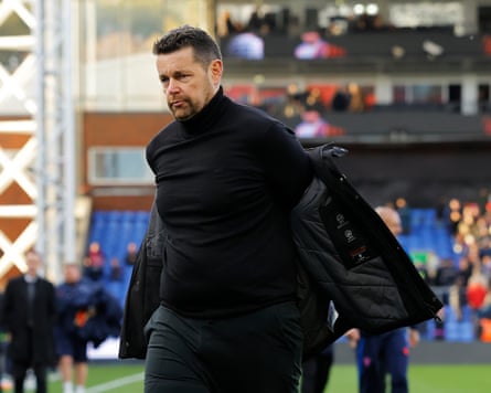 The Crystal Palace manager, Pierre Sage, walks off the pitch at Selhurst Park after his team's 2-0 defeat to Newcastle in the Premier League.