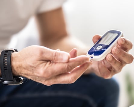 Man checks his blood sugar levels